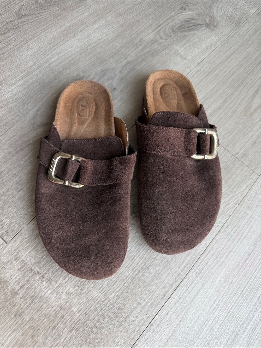 Flattered brown suede shoes